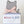 A gray felt cat-shaped decorative item tied with a pale pink ribbon and wrapped in a white gift box labeled 'love is felt' and 'Studio B Collars' on a clean white background.